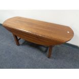 A mahogany refectory flap sided coffee table