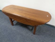 A mahogany refectory flap sided coffee table