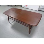 An Ercol elm and beech coffee table with under shelf in antique finish