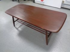 An Ercol elm and beech coffee table with under shelf in antique finish