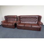 A brown buttoned leather Chesterfield three seater wingback settee with matching two seater settee.