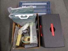 A box of assorted tools, hardware, face masks, gazebo panels,