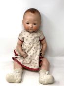 An Armand Marseille bisque-headed jointed doll stamped AM Germany 351/8K