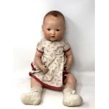 An Armand Marseille bisque-headed jointed doll stamped AM Germany 351/8K