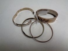 Four silver bangles