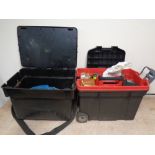 A large plastic fishing box and a tool box on wheels containing fishing equipment to include lures,