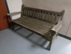 A wooden slatted garden bench.