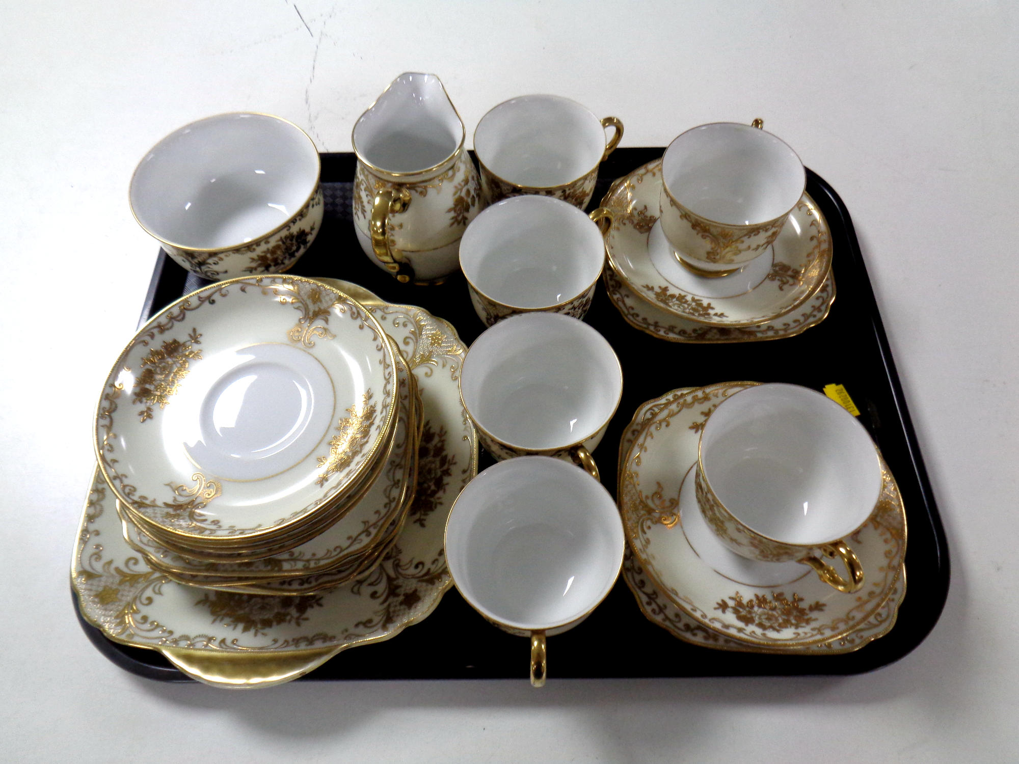 A tray containing twenty-one piece Meito hand painted china tea service.