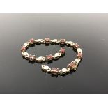 A 9ct gold gem set bracelet (broken). CONDITION REPORT: 10.