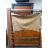 An Edwardian 5' stained beech bed frame with box spring.