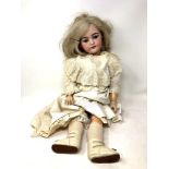 A Schmidt & Co bisque-headed doll stamped S&C Germany
