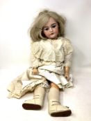 A Schmidt & Co bisque-headed doll stamped S&C Germany