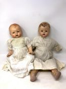 Two bisque headed dolls, one stamped '4 Germany 25'.