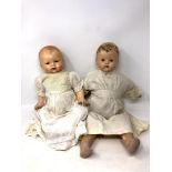 Two bisque headed dolls, one stamped '4 Germany 25'.