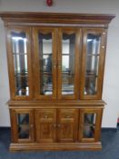 An American style four door display cabinet fitted cupboards beneath