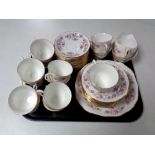 A tray of forty-four pieces of Royal Osbourne pink rose patterned tea china.
