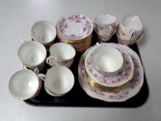 A tray of forty-four pieces of Royal Osbourne pink rose patterned tea china.
