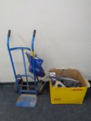 A sack barrow together with heavy duty ratchet straps and a box of a quantity of electrical cabling.