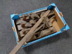 A box of four antique woodworking block planes.
