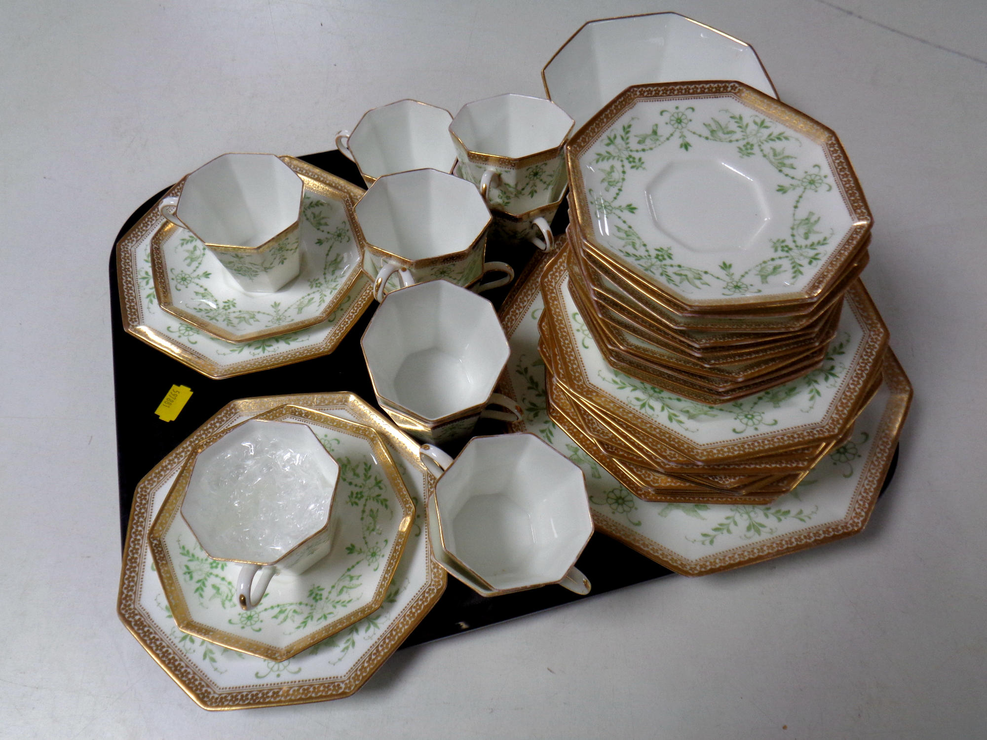 A tray containing thirty-nine piece antique Wedgwood octagonal bone china tea service.