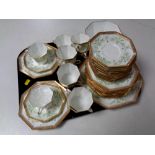 A tray containing thirty-nine piece antique Wedgwood octagonal bone china tea service.