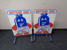 Two bottled gas advertisement stands.