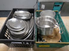 Two crates of a quantity of commercial kitchen equipment to include stainless steel trays, colander,