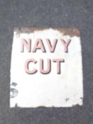 A part enamelled sign bearing Navy Cut advertisement.
