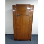 A twentieth century oak single door wardrobe