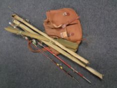 A small quantity of fly fishing rods to include a split cane example together with a fishing bag