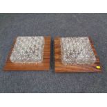Two mid 20th century wall lights mounted on rosewood effect boards.