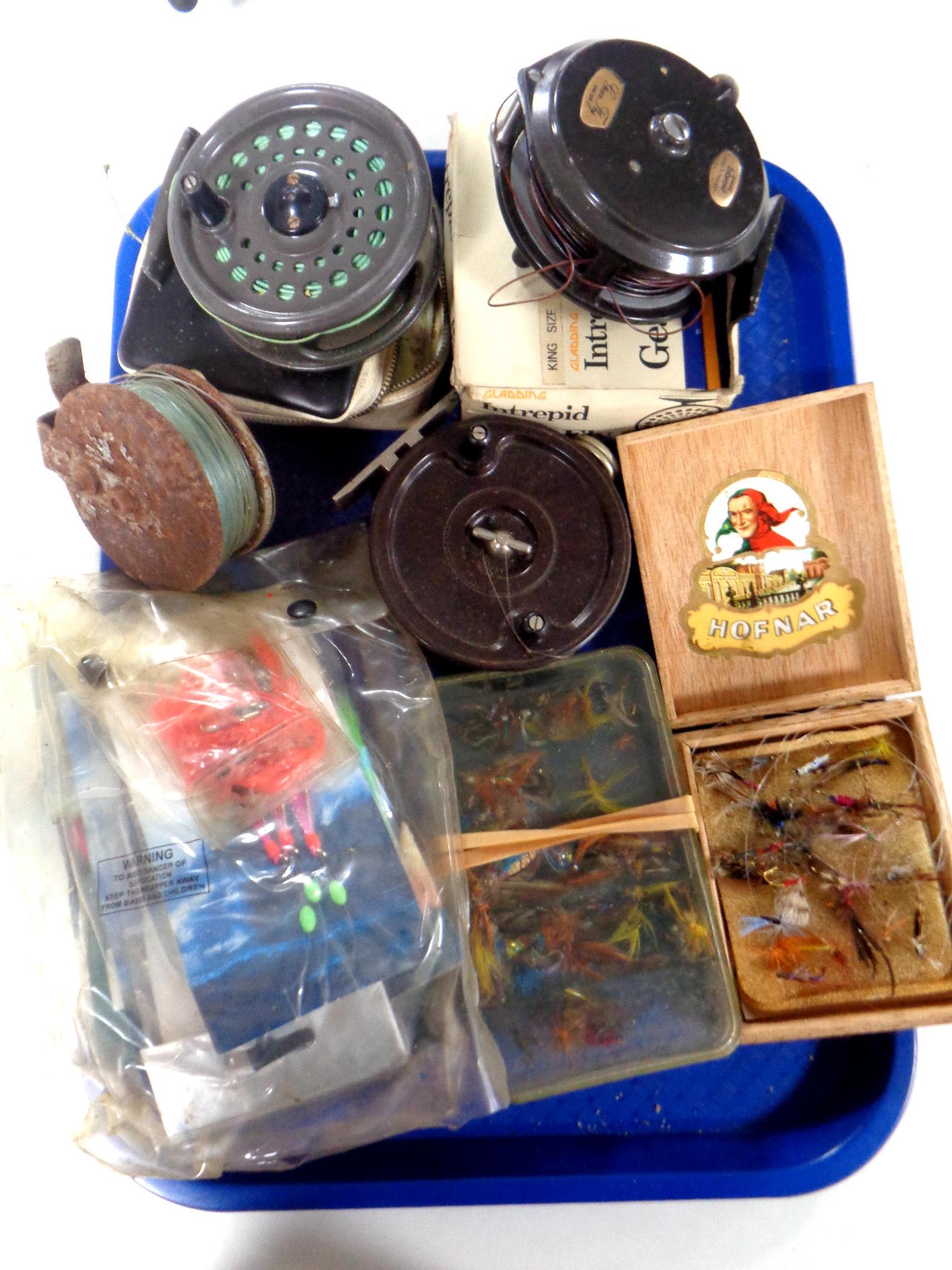 A tray containing fly fishing reels by Allcock and Intrepid,