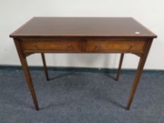 A Victorian style two drawer side table