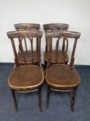 A set of four bentwood dining chairs.