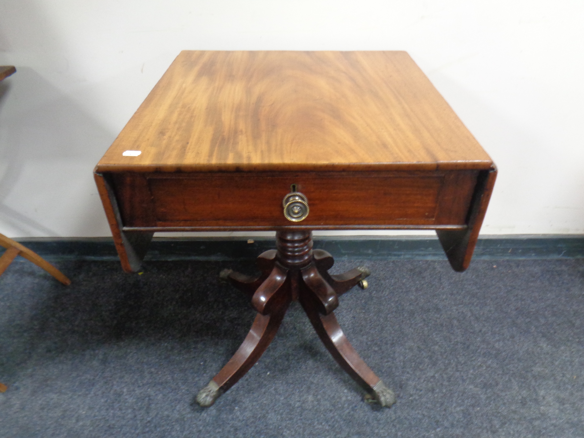 A nineteenth century mahogany flap sided occasional table fitted a drawer