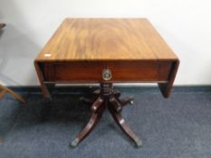 A nineteenth century mahogany flap sided occasional table fitted a drawer