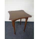 A shaped Edwardian occasional table.