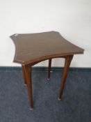 A shaped Edwardian occasional table.