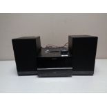 A Sony CD/DAB music centre with docking station and two speakers.