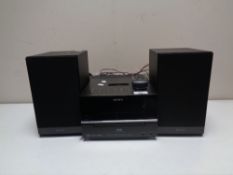 A Sony CD/DAB music centre with docking station and two speakers.