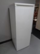 An upright freezer.
