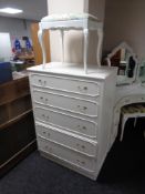A cream five drawer chest with gilt handles and matching stool