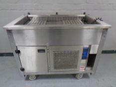 A Moffat commercial stainless steel bain marie counter with food warmer beneath, width 116cm (a/f).