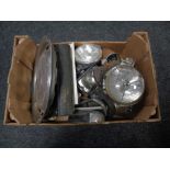 A box of vintage car lights, Land Rover workshop manual, speedometers, Mercedes hub cap etc.