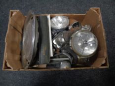 A box of vintage car lights, Land Rover workshop manual, speedometers, Mercedes hub cap etc.