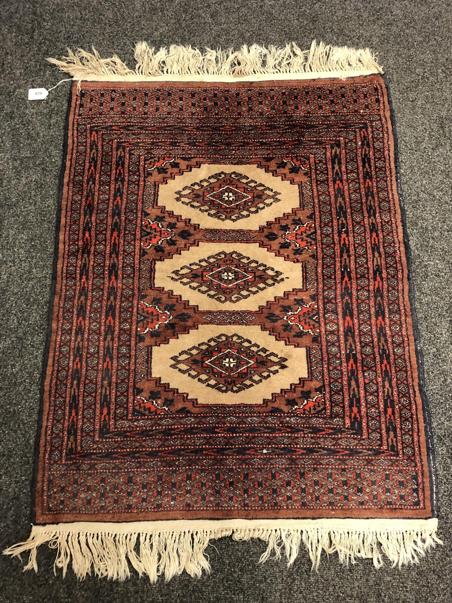 An Afghan rug of geometric design,