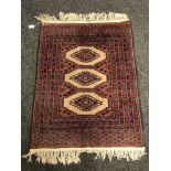 An Afghan rug of geometric design,