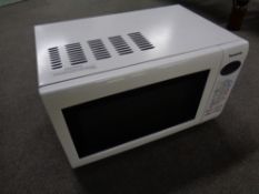 A Panasonic Inverter microwave together with a ceramic knife set, boxed.