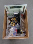A box of miscellany to include digital scales, battery, battery charger, headphones etc.
