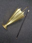 A brass stick stand in the form of a parasol together with a 19th century ebonised walking cane.